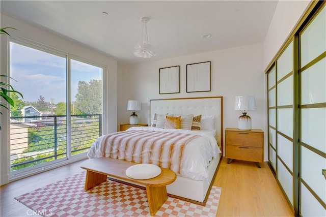 712 N Chestnut Ave, Los Angeles, CA 90042 - bedroom featuring access to exterior and light wood finished floors