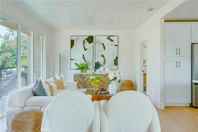 712 N Chestnut Ave, Los Angeles, CA 90042 - dining area with light wood finished floors and recessed lighting