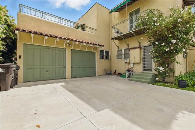 236 Temple Ave, Long Beach, CA 90803 - view of front facade featuring concrete driveway, stucco siding, and an attached garage