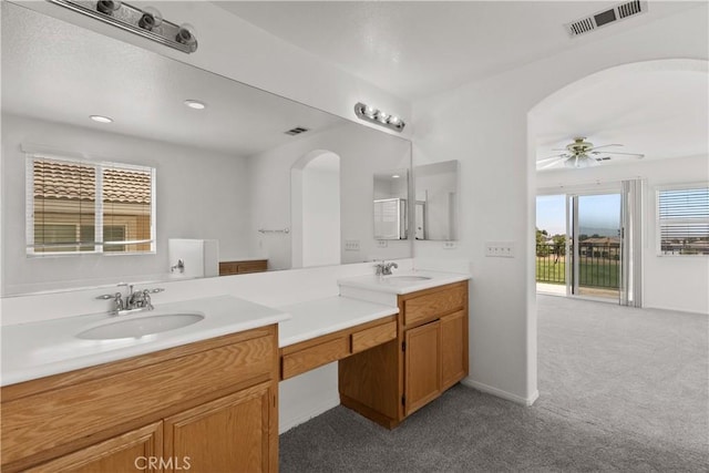 4349 Bethpage Dr, Palmdale, CA 93551 - full bath with double vanity, a ceiling fan, and carpet floors
