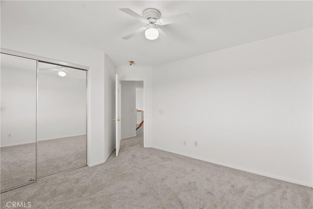 4349 Bethpage Dr, Palmdale, CA 93551 - unfurnished bedroom with carpet flooring, a closet, baseboards, and a ceiling fan