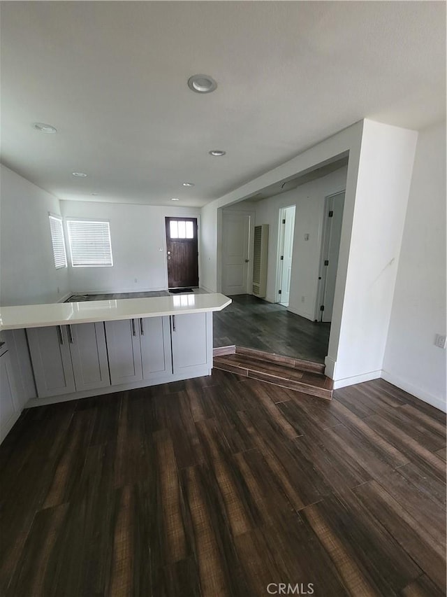 2706 E 57th St, Long Beach, CA 90805 - kitchen with dark wood-style floors, light countertops, gray cabinets, open floor plan, and recessed lighting