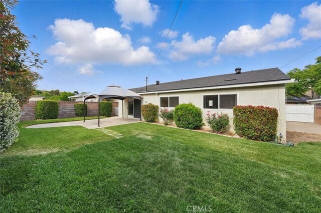 27129 Elias Ave, Saugus, CA 91350 - rear view of house with a gazebo, stucco siding, and a patio area