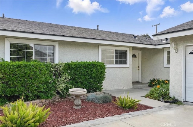 27129 Elias Ave, Saugus, CA 91350 - view of exterior entry with stucco siding and a garage