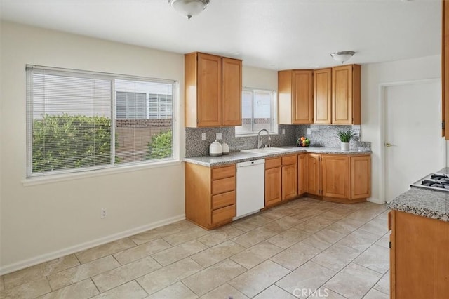 27129 Elias Ave, Saugus, CA 91350 - kitchen with dishwasher, a sink, backsplash, baseboards, and gas cooktop
