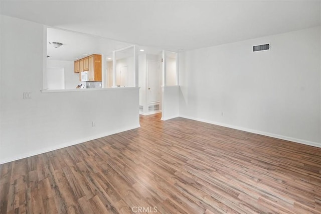 27129 Elias Ave, Saugus, CA 91350 - unfurnished living room featuring wood finished floors and baseboards