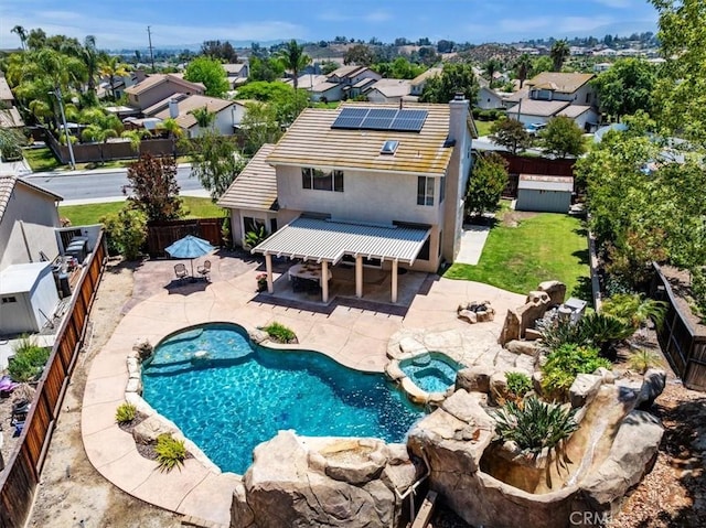 39741 Jacaranda Ct, Temecula, CA 92591 - view of swimming pool featuring a fenced backyard, a patio area, a residential view, and a pool with connected hot tub