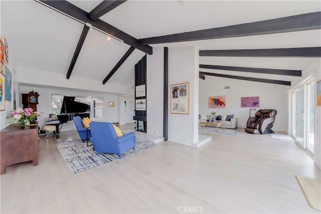 741 W Wedgewood Ln, La Habra, CA 90631 - living room featuring wood finished floors, beam ceiling, plenty of natural light, and high vaulted ceiling