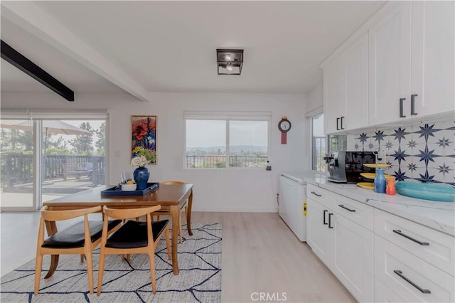 741 W Wedgewood Ln, La Habra, CA 90631 - kitchen with white cabinetry, light wood-style floors, decorative backsplash, light stone counters, and beam ceiling