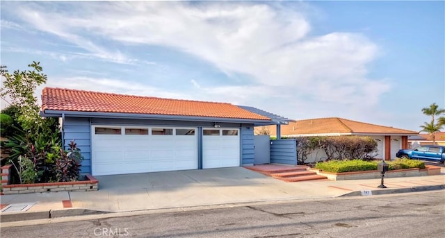 741 W Wedgewood Ln, La Habra, CA 90631 - ranch-style home with a tiled roof, driveway, and a garage