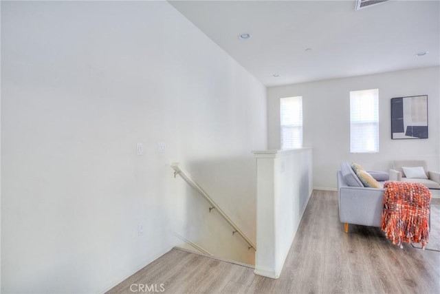 12456 Cassiopeia Ct, Eastvale, CA 91752 - stairway featuring wood finished floors and baseboards