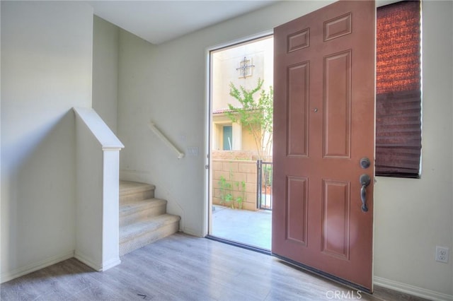 12456 Cassiopeia Ct, Eastvale, CA 91752 - foyer entrance featuring wood finished floors and stairs