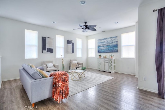 12456 Cassiopeia Ct, Eastvale, CA 91752 - living area with wood finished floors, a ceiling fan, and recessed lighting