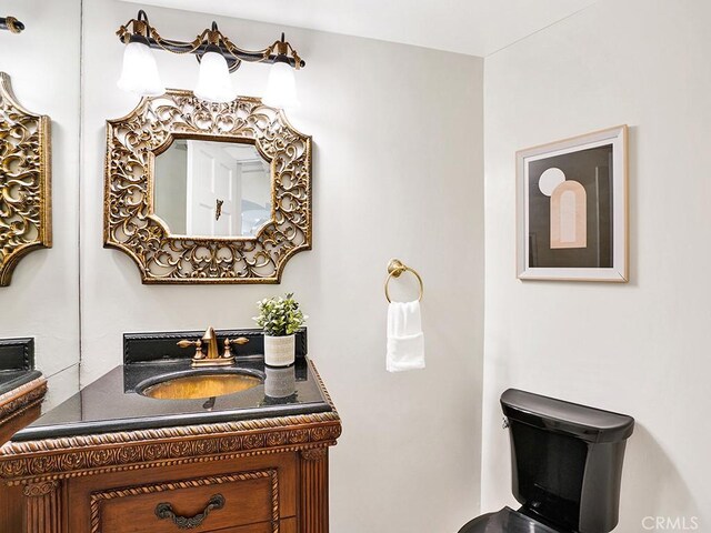 30461 Puerto Vallarta Dr, Laguna Niguel, CA 92677 - half bathroom featuring vanity and toilet
