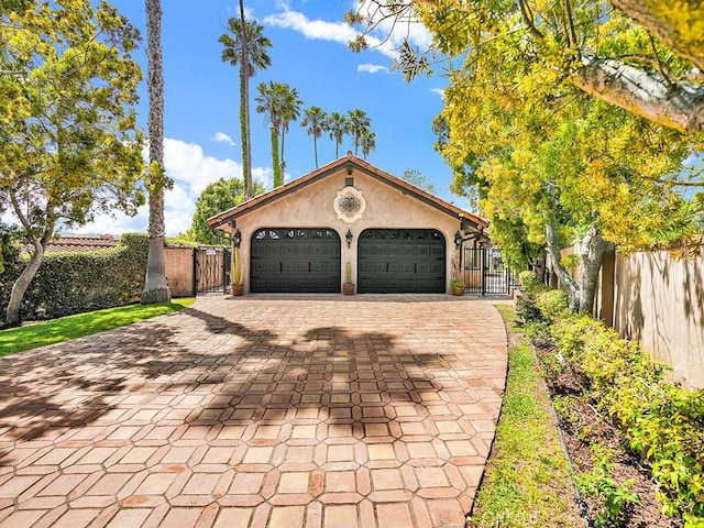 30461 Puerto Vallarta Dr, Laguna Niguel, CA 92677 - garage with a gate and decorative driveway