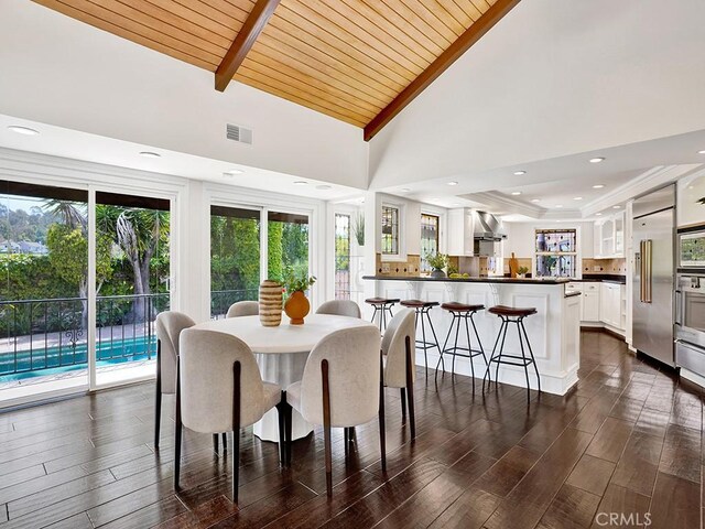 30461 Puerto Vallarta Dr, Laguna Niguel, CA 92677 - dining space with lofted ceiling, wooden ceiling, dark wood finished floors, and recessed lighting