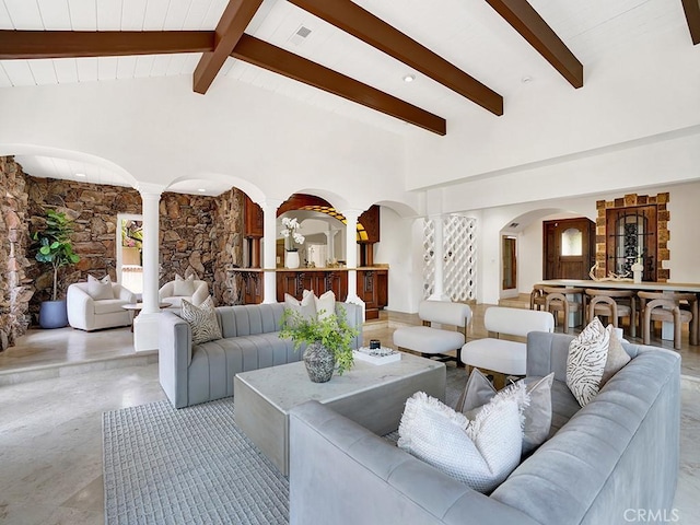 30461 Puerto Vallarta Dr, Laguna Niguel, CA 92677 - living area featuring ornate columns, arched walkways, beamed ceiling, and high vaulted ceiling