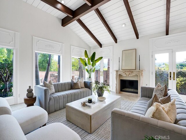 30461 Puerto Vallarta Dr, Laguna Niguel, CA 92677 - living area with healthy amount of natural light, french doors, wood ceiling, and a high end fireplace