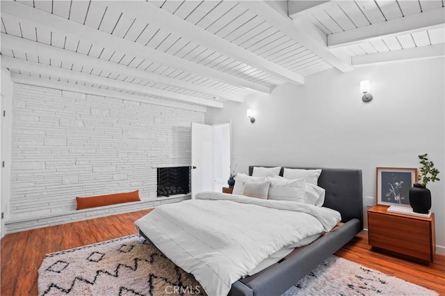 4000 Via Cardelina, Palos Verdes Estates, CA 90274 - bedroom featuring wood finished floors, wooden ceiling, and a stone fireplace
