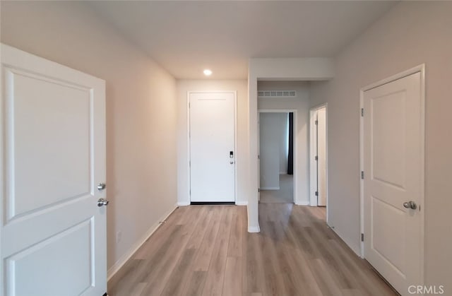 24311 Insignia Dr, Menifee, CA 92584 - hall featuring light wood-style flooring, recessed lighting, and baseboards