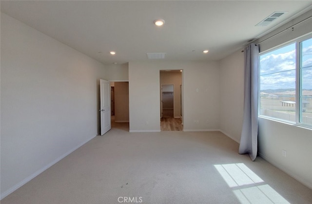 24311 Insignia Dr, Menifee, CA 92584 - empty room with recessed lighting, light carpet, and baseboards