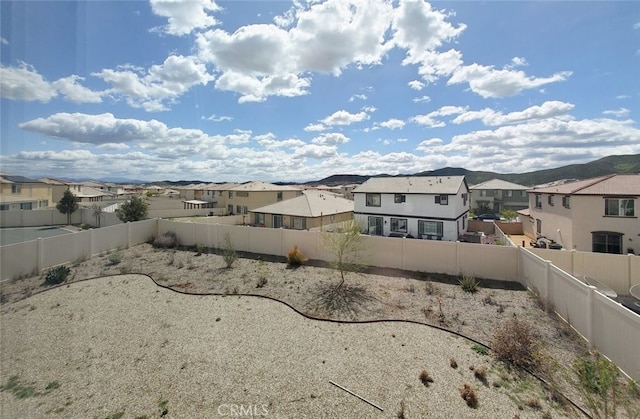 24311 Insignia Dr, Menifee, CA 92584 - fenced backyard featuring a residential view