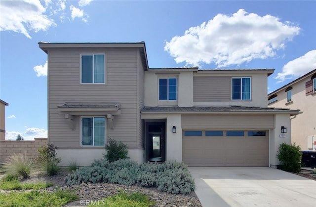 24311 Insignia Dr, Menifee, CA 92584 - traditional-style house with driveway, an attached garage, and stucco siding