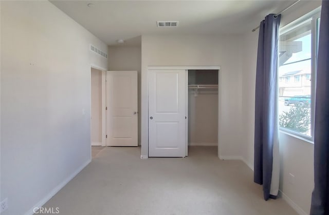 24311 Insignia Dr, Menifee, CA 92584 - unfurnished bedroom with a closet, light carpet, and baseboards