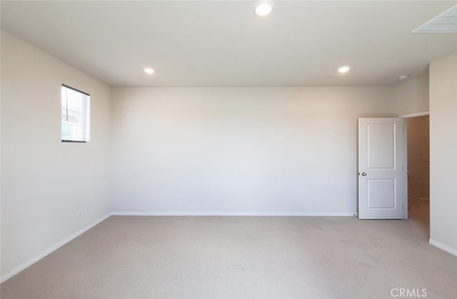 24311 Insignia Dr, Menifee, CA 92584 - spare room with light carpet, baseboards, and recessed lighting