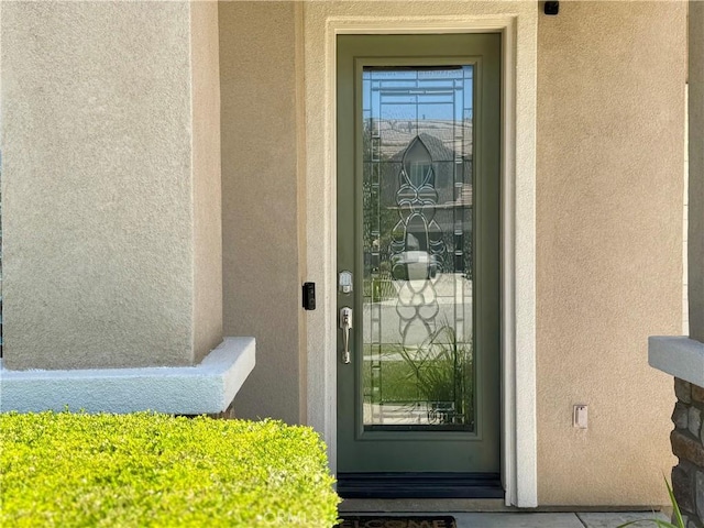 34238 Baja Ct, Lake Elsinore, CA 92532 - doorway to property featuring stucco siding