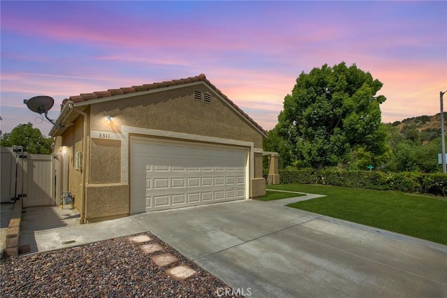 3311 Avocado Vista Ln, Fallbrook, CA 92028 - view of front of property featuring stucco siding, a yard, a gate, and driveway
