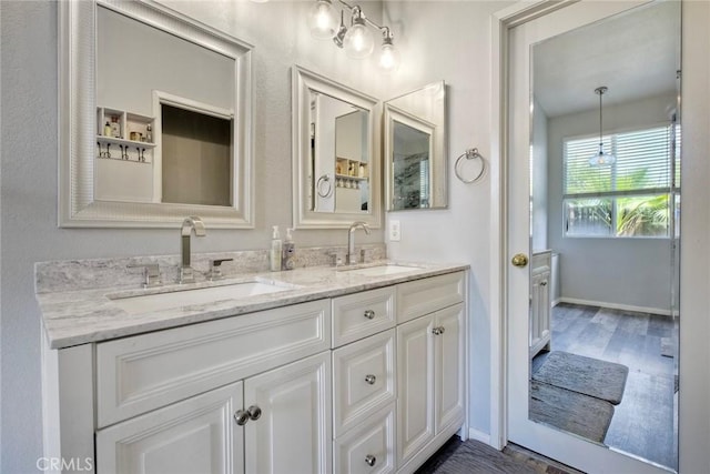 3311 Avocado Vista Ln, Fallbrook, CA 92028 - full bath with double vanity, wood finished floors, and baseboards