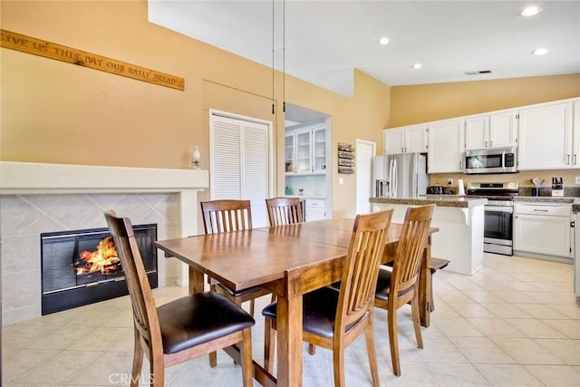 3311 Avocado Vista Ln, Fallbrook, CA 92028 - dining room featuring vaulted ceiling, a high end fireplace, light tile patterned floors, and recessed lighting