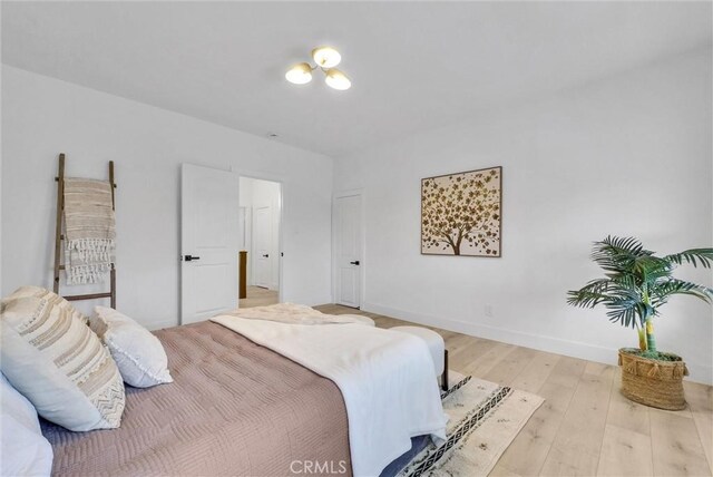 239 N San Antonio Ave, Upland, CA 91786 - bedroom with wood finished floors and baseboards