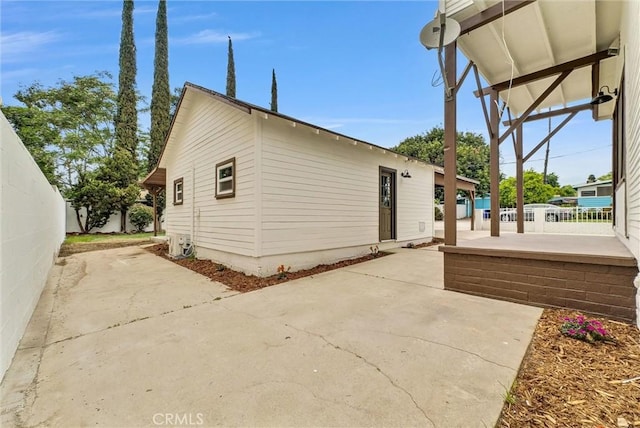 239 N San Antonio Ave, Upland, CA 91786 - view of side of home featuring a patio area