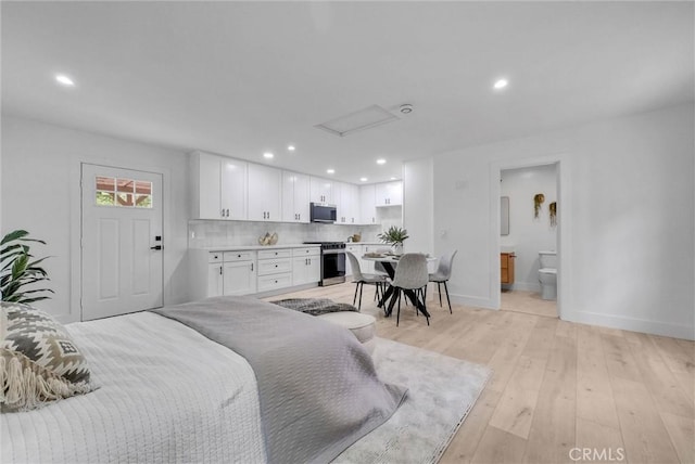 239 N San Antonio Ave, Upland, CA 91786 - bedroom with recessed lighting, baseboards, light wood-type flooring, attic access, and ensuite bath