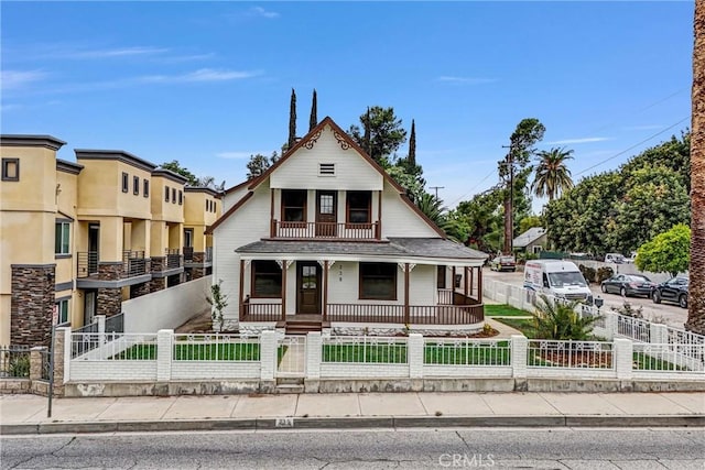 239 N San Antonio Ave, Upland, CA 91786 - view of front of property featuring covered porch, a fenced front yard, and a balcony