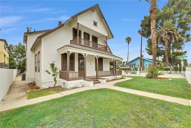 239 N San Antonio Ave, Upland, CA 91786 - view of front of home with a porch, a balcony, a chimney, and central air condition unit