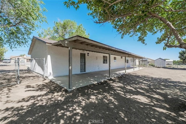7727 Oakwood Ave, Hesperia, CA 92345 - rear view of property with a patio and stucco siding