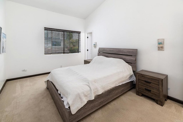 7335 Alicante Rd Unit C, Carlsbad, CA 92009 - bedroom featuring light carpet, baseboards, and vaulted ceiling