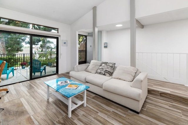 7335 Alicante Rd Unit C, Carlsbad, CA 92009 - living room with vaulted ceiling and wood finished floors