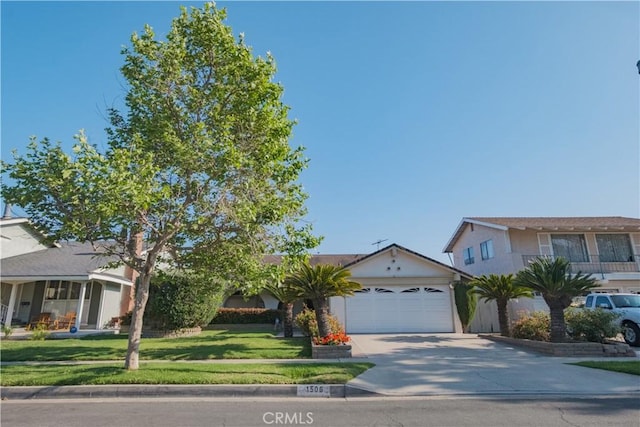 1506 W Sharon Rd, Santa Ana, CA 92706 - view of front of home with concrete driveway, a garage, a front lawn, and stucco siding