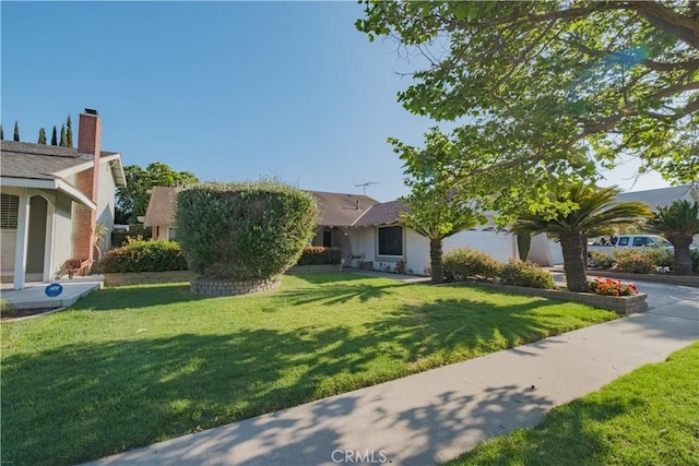 1506 W Sharon Rd, Santa Ana, CA 92706 - view of front facade featuring a front lawn and stucco siding