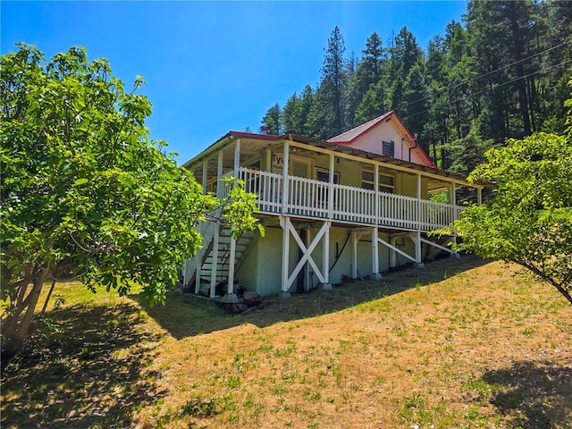 38703 State Highway 96, Klamath River, CA 96086 - back of house with metal roof, stairs, a yard, and a deck
