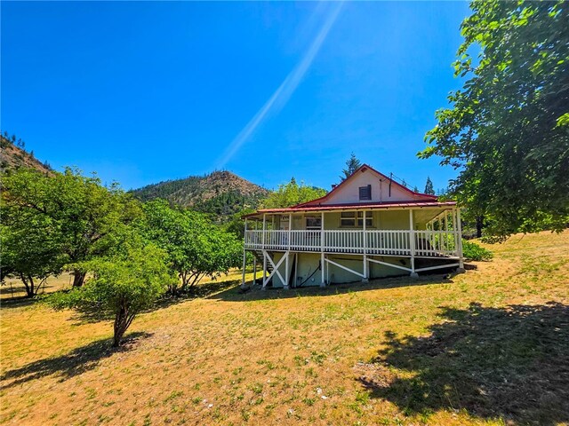 38703 State Highway 96, Klamath River, CA 96086 - rear view of house with covered porch and a yard