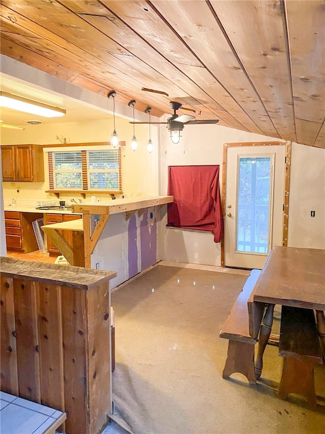 38703 State Highway 96, Klamath River, CA 96086 - kitchen featuring wooden ceiling, brown cabinets, decorative light fixtures, and light countertops