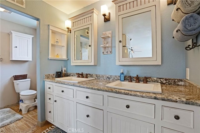 17882 Hallcroft Ln, Huntington Beach, CA 92647 - full bathroom with wood finished floors and double vanity