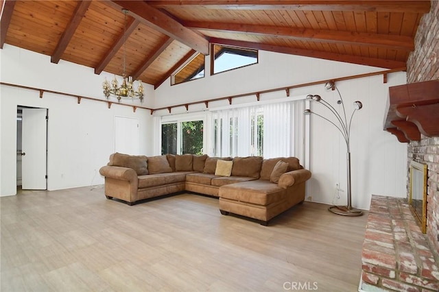 5655 Wish Ave, Encino, CA 91316 - living room with wood ceiling with exposed beams, light wood finished floors, a chandelier, a fireplace, and high vaulted ceiling