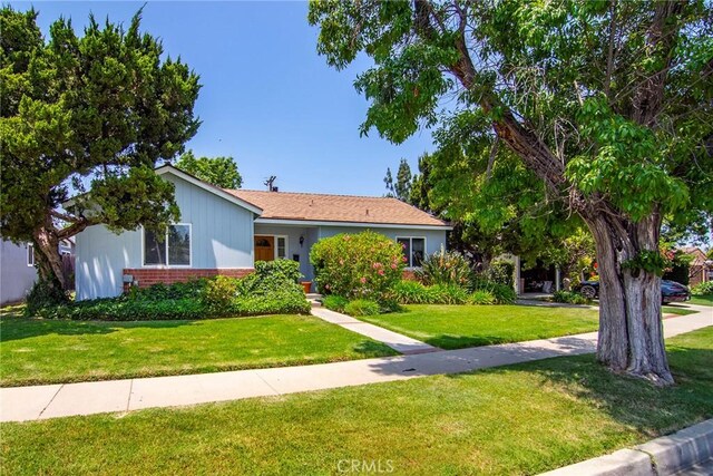 5655 Wish Ave, Encino, CA 91316 - view of front of property with brick siding and a front yard