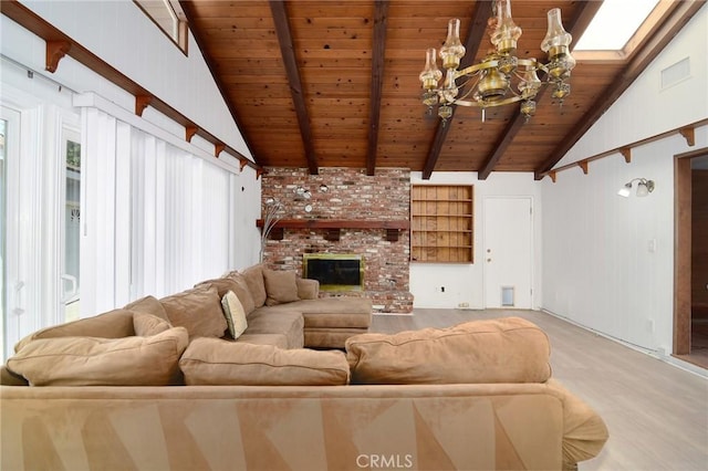 5655 Wish Ave, Encino, CA 91316 - living area with wooden ceiling, a chandelier, a fireplace, and light wood-style flooring